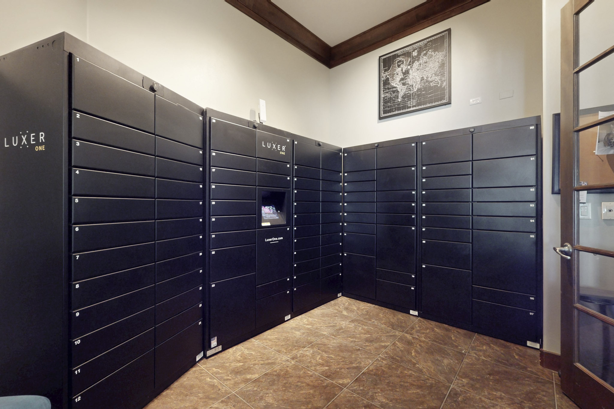 Modern secure package room with Luxer One lockers and elegant flooring, ideal for convenient apartment living.