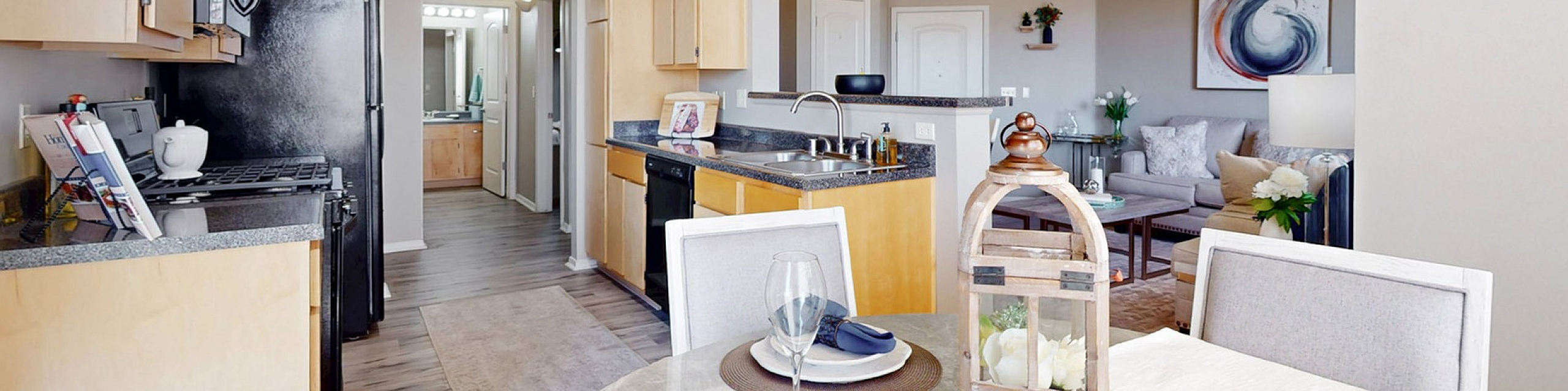 Bright and elegant open-concept kitchen and living area with modern decor and dining setup.