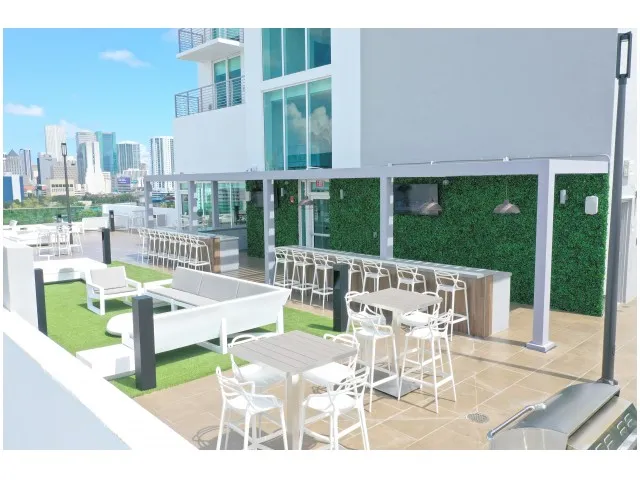 9th Floor Party Room and Deck with 2 Bars, Large Screen TVs, Billiards, Sun Lounges and BBQ Grills