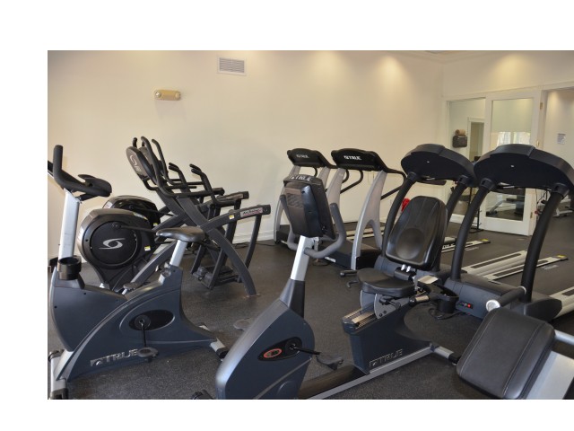Image of Health and Fitness Center with an Array of Exercise Equipment & Free Weights for Country Club Towers