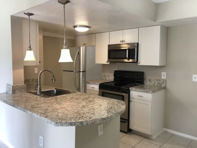 Kitchen with Granite countertops and stainless steel appliances
