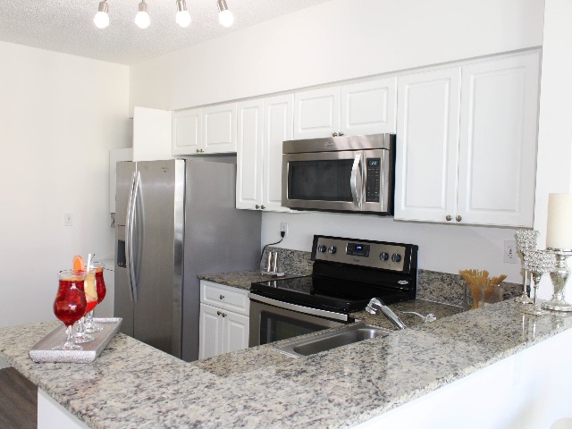 Granite Countertops with Modern, White Wood Cabinetry & Self-Closing Hinges*