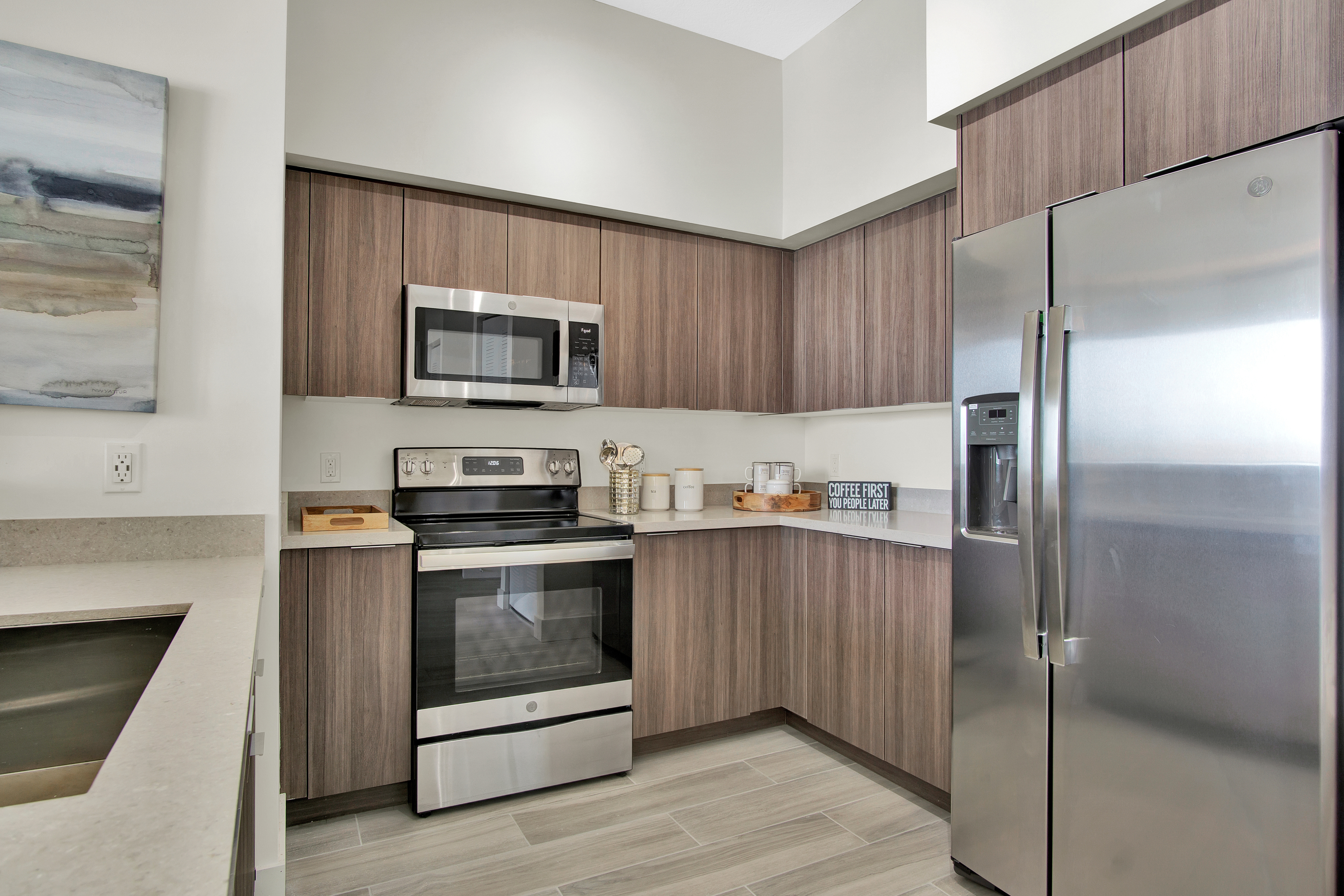 Italian Kitchens Complete with Breakfast Bar and Walnut Cabinetry
