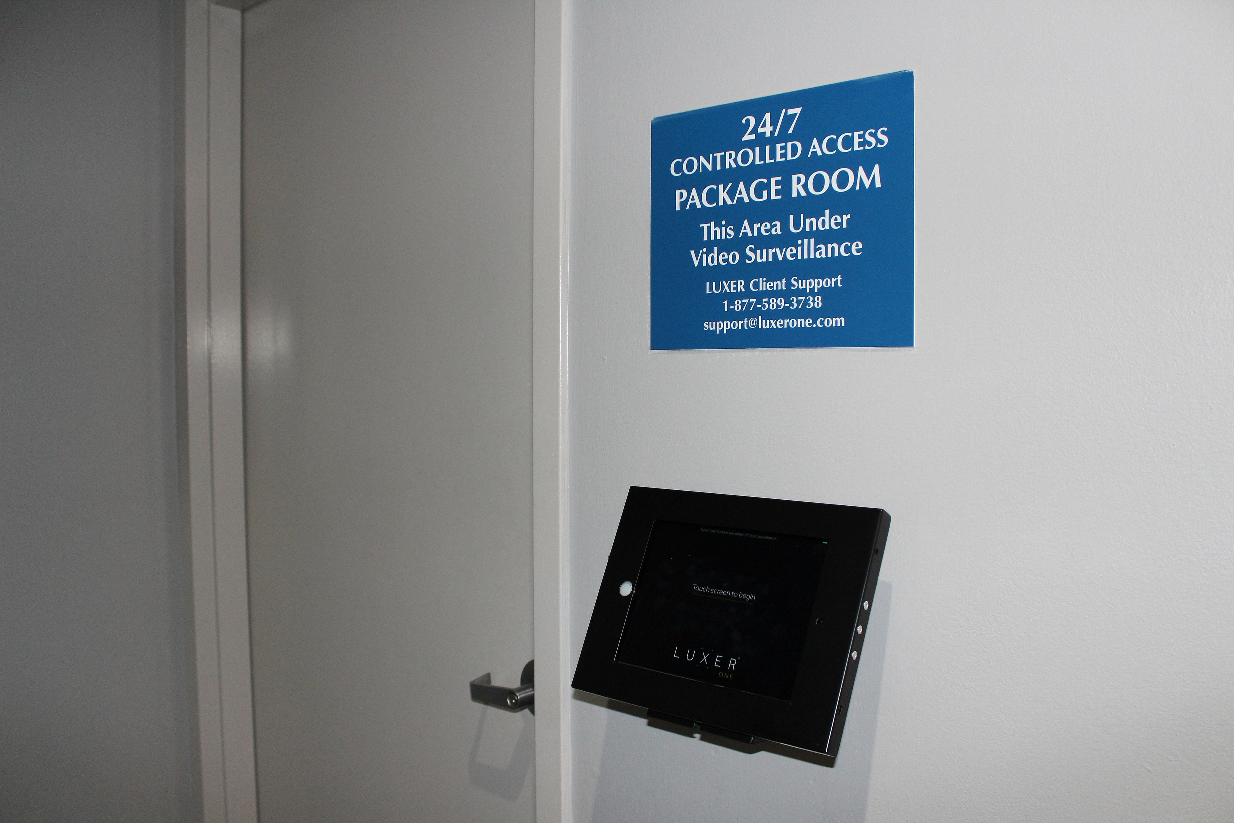 Modern 24/7 controlled access package room with advanced surveillance and user-friendly touchscreen interface.
