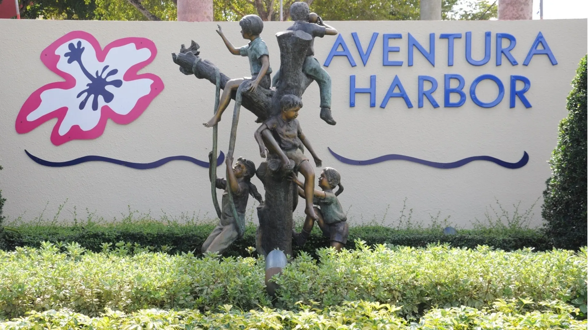 Entrance community sign with statue