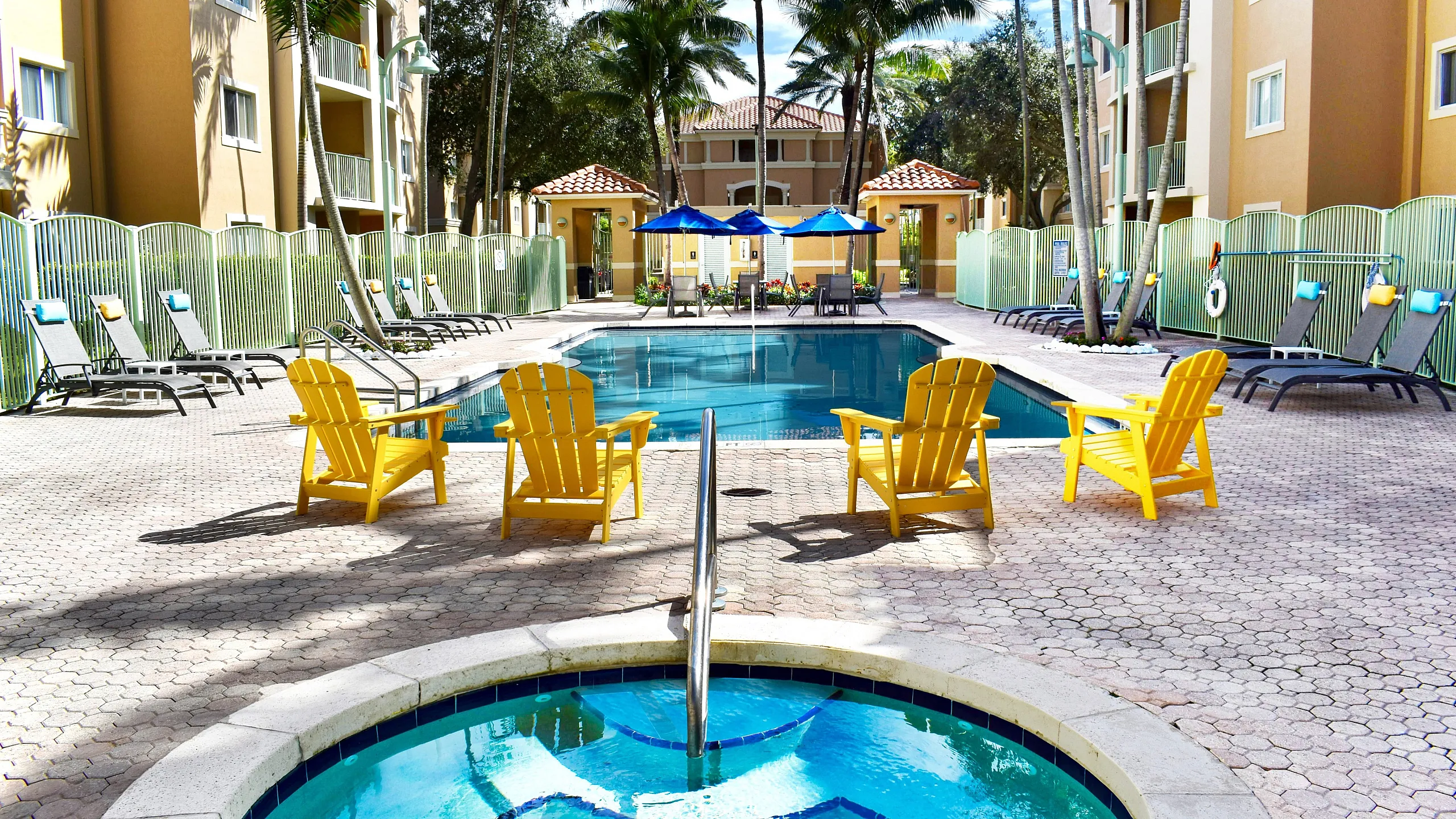 sunrise village pool deck, lounge chairs, large pool, jacuzzi