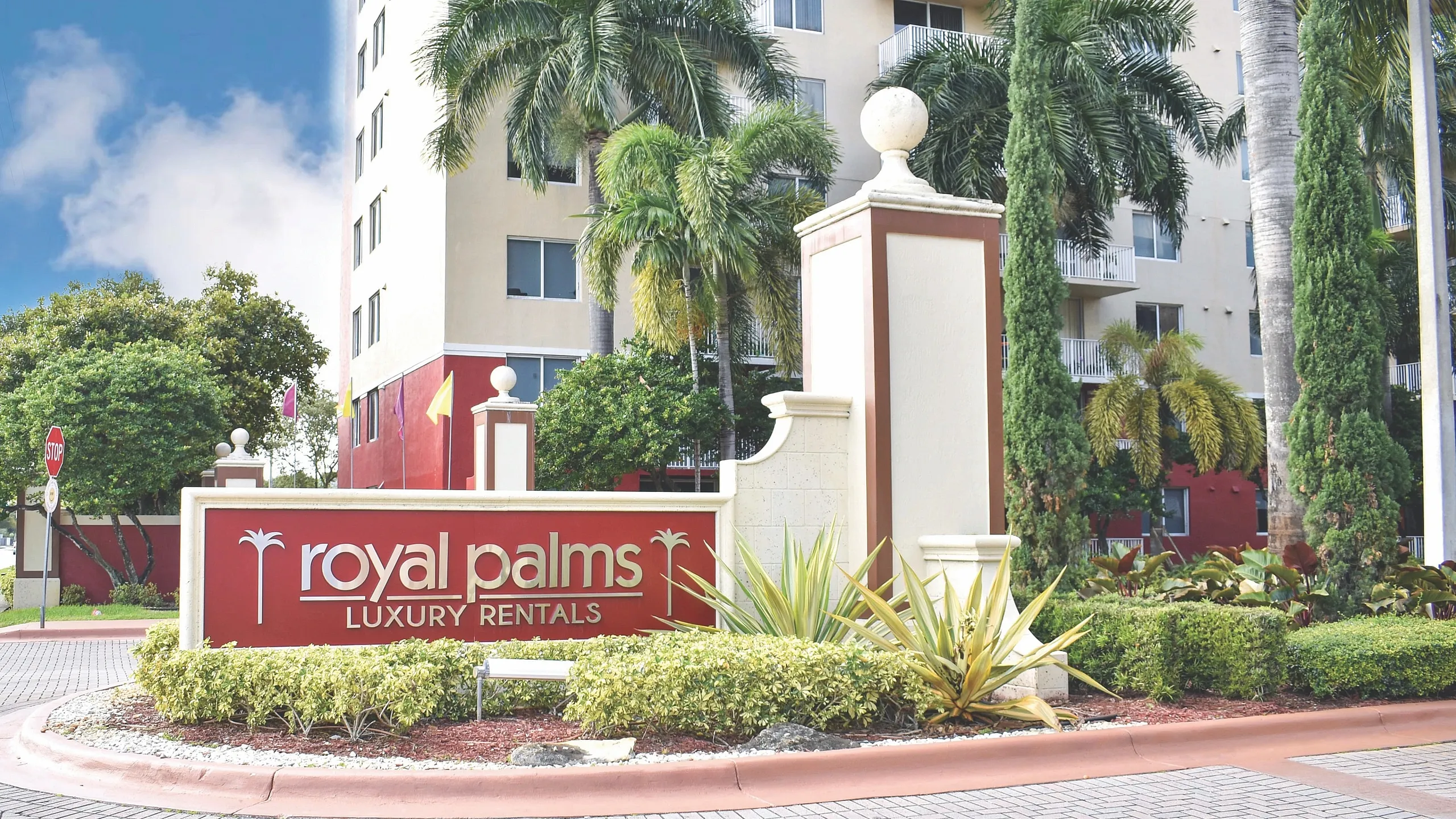Elegant Royal Palms Luxury Rentals featuring lush landscaping and modern architecture.