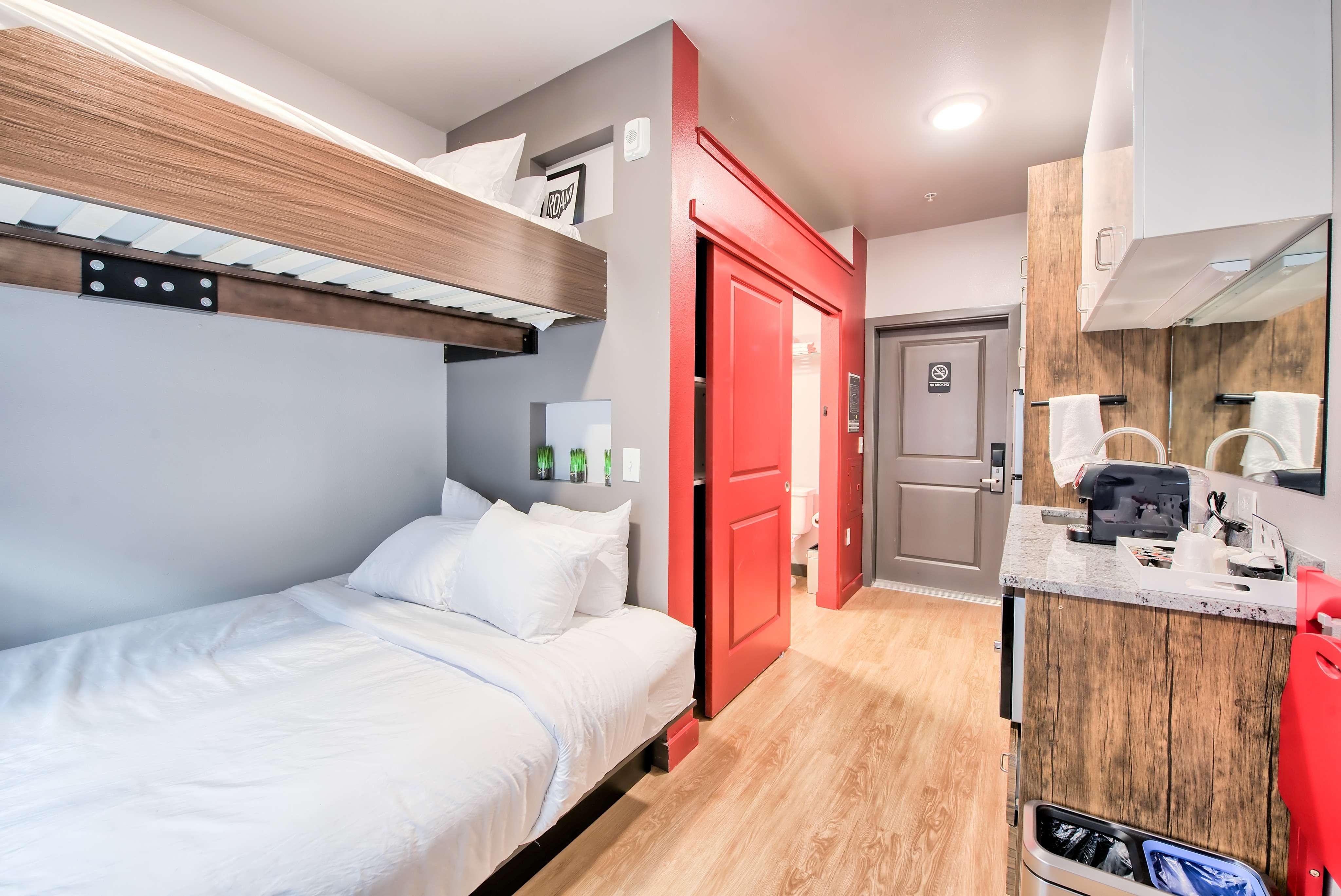 lofted beds in a modern-style micro apartment