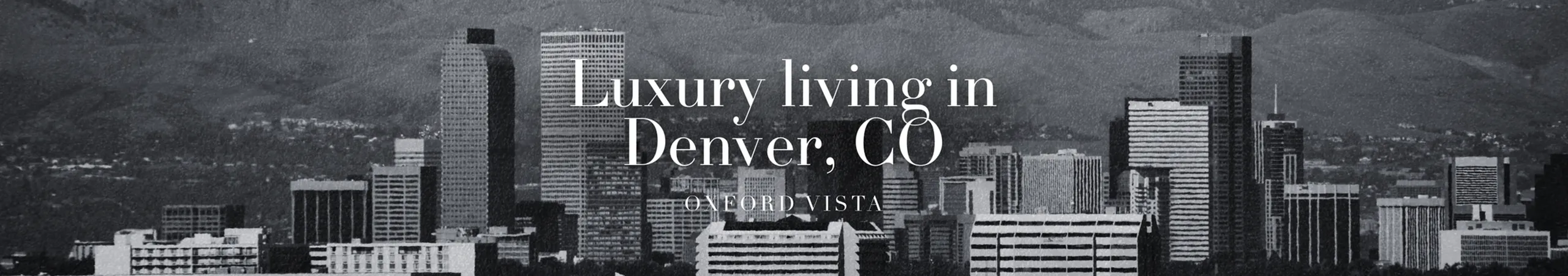 Black-and-white view of the Denver skyline with mountain backdrops and the Oxford Vista branding promoting luxury living in Denver, CO.