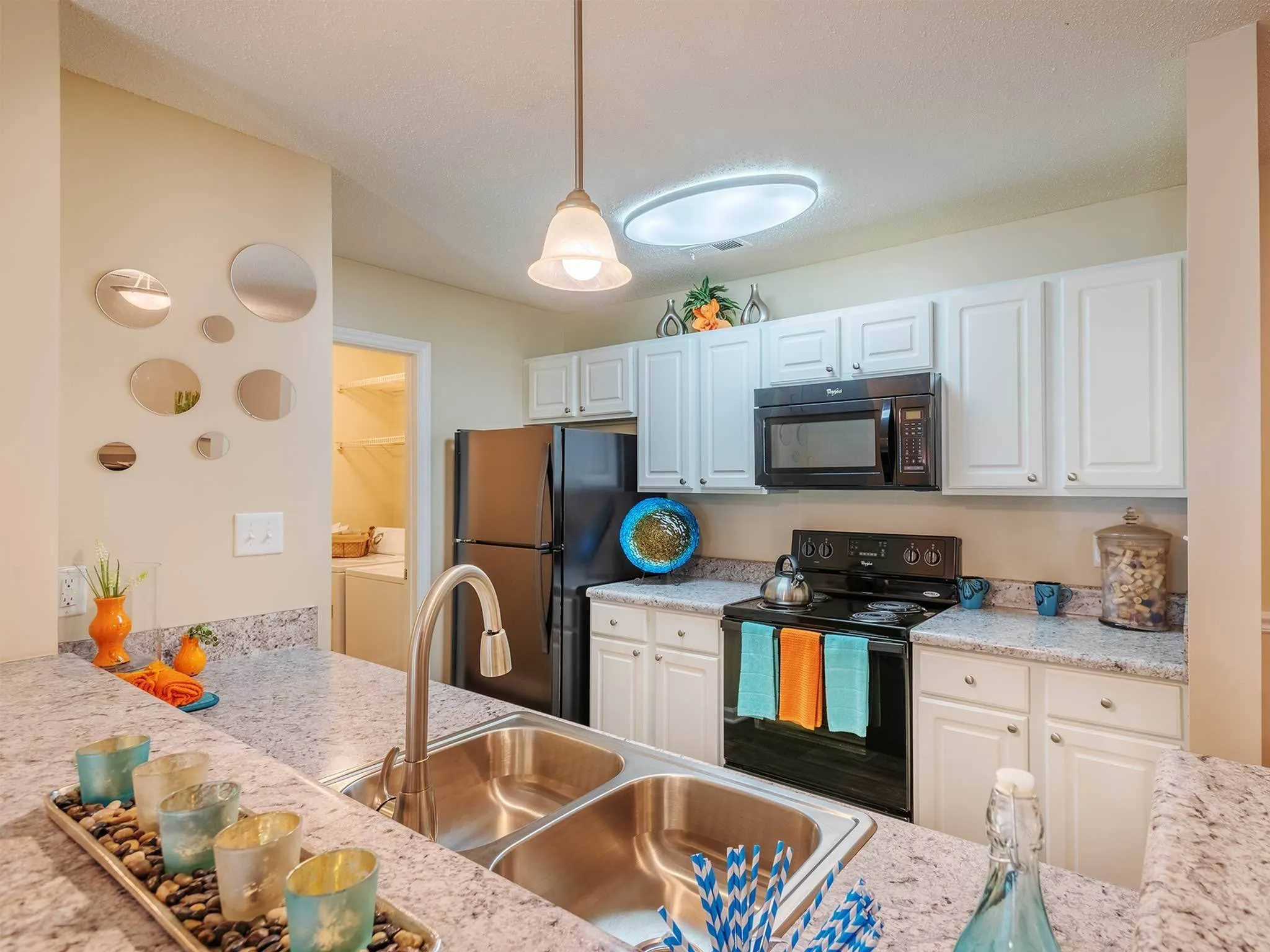 Gourmet kitchen, white cabinetry, hook-neck deep sink, granite countertops