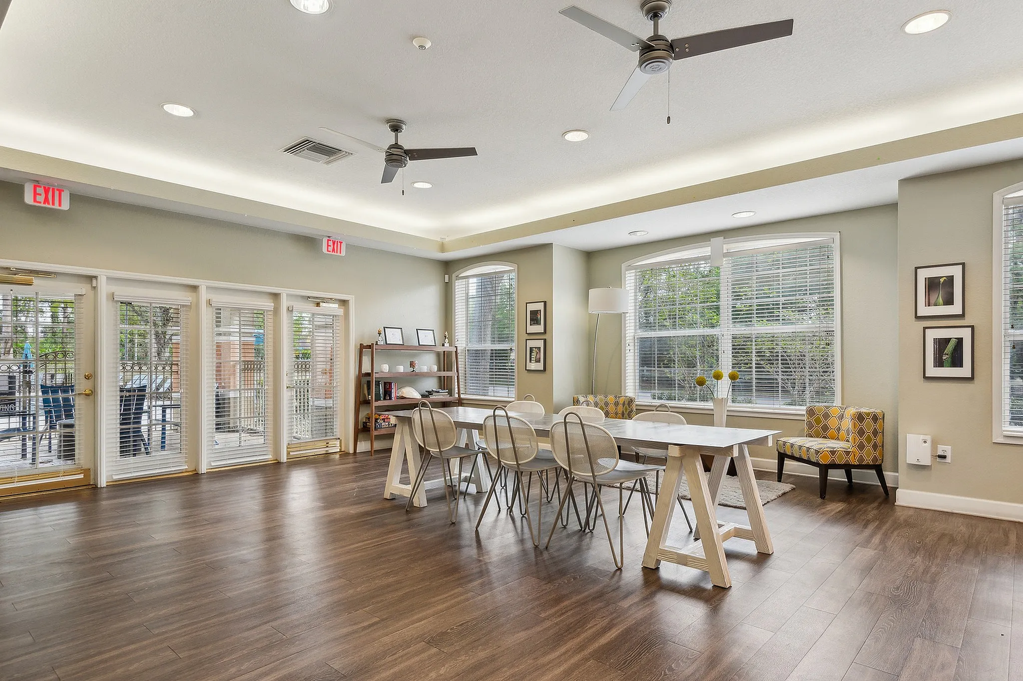 Bright and airy communal space with modern furniture, large windows, and chic decor, perfect for gatherings and relaxation.