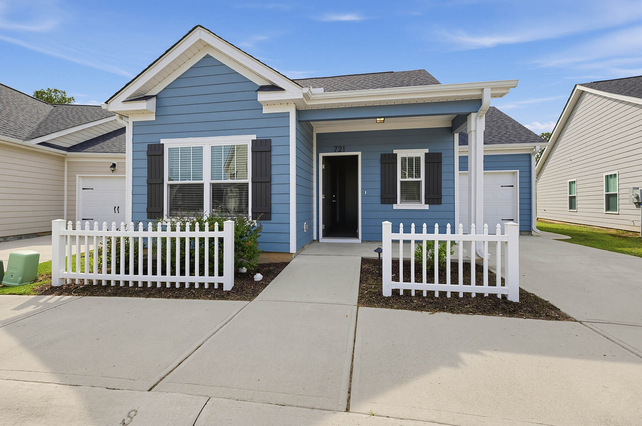 LEO at the Sanctuary- Single Family Rental Homes - Blue House Exterior