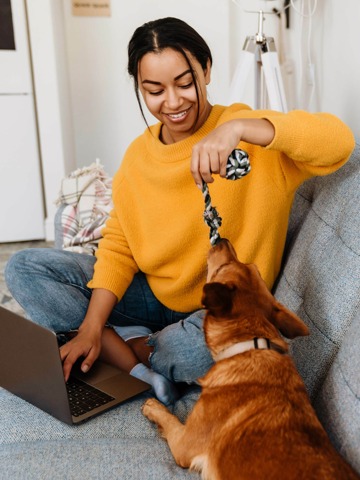 resident playing with dog at her living room at her homes near huntsville