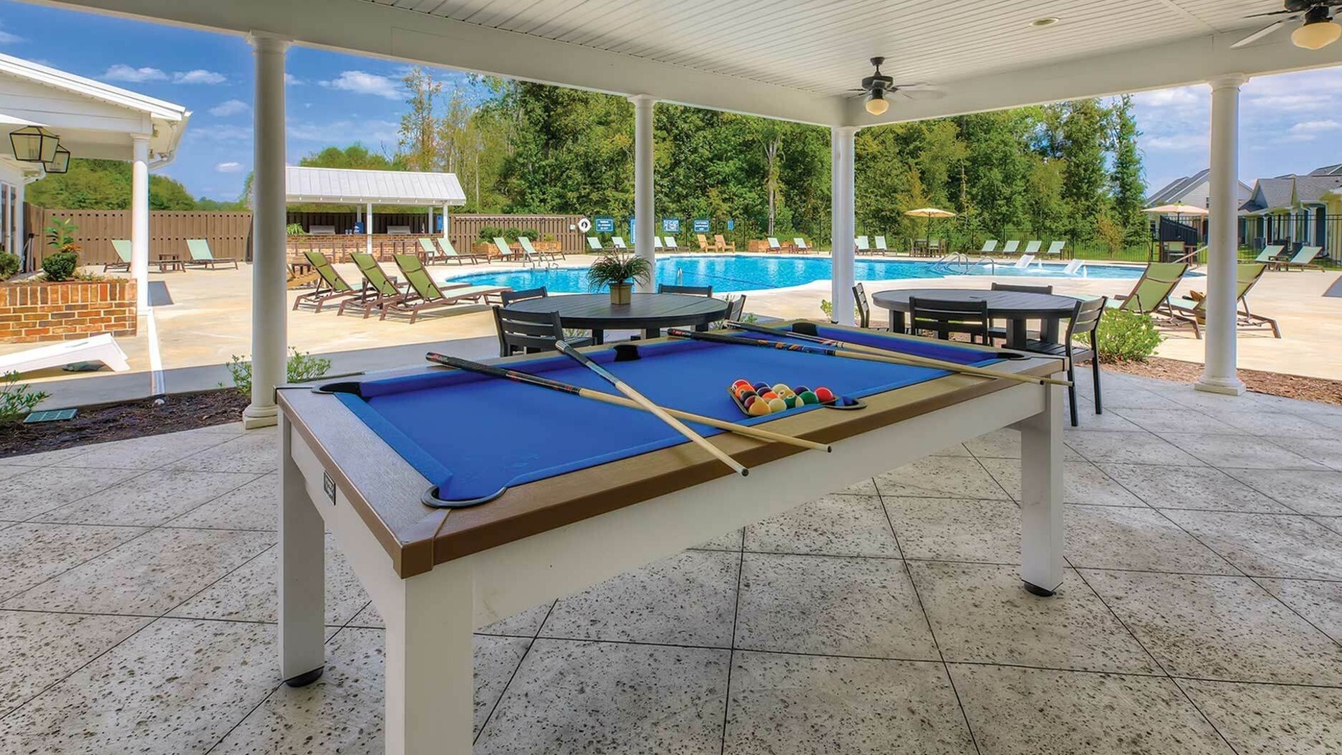 pool table and exterior shot of swimming pool at LEO at The Sanctuary