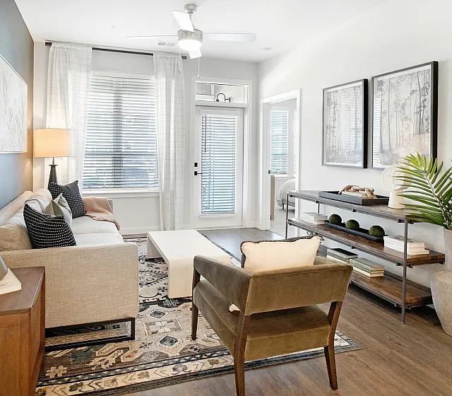 Contemporary living room with cozy seating, stylish decor, and abundant natural light.
