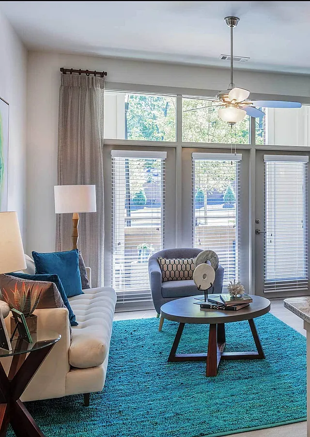 Contemporary open-plan living room with stylish furniture and natural light.