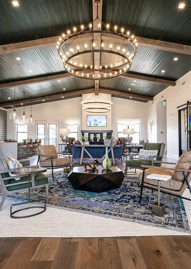 Elegant apartment lounge with modern decor, stylish lighting, and cozy seating area.