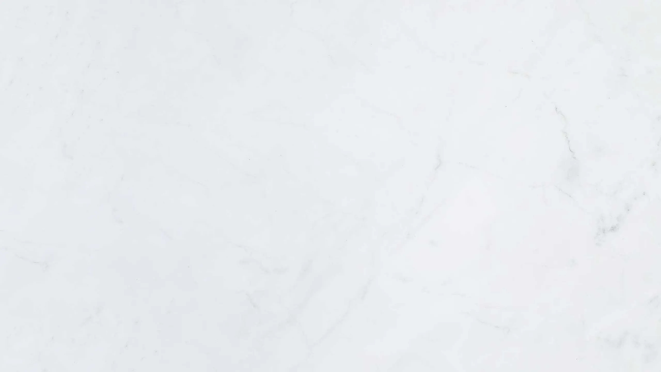 Smooth white marble flooring with subtle veining details.