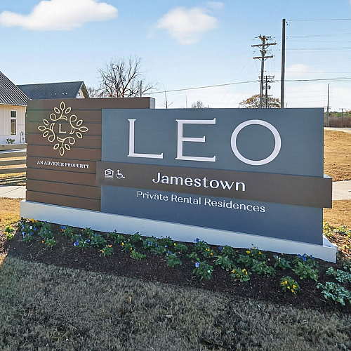Charming exterior view of Leo Jamestown, showcasing modern architecture and lush landscaping at private rental residences.