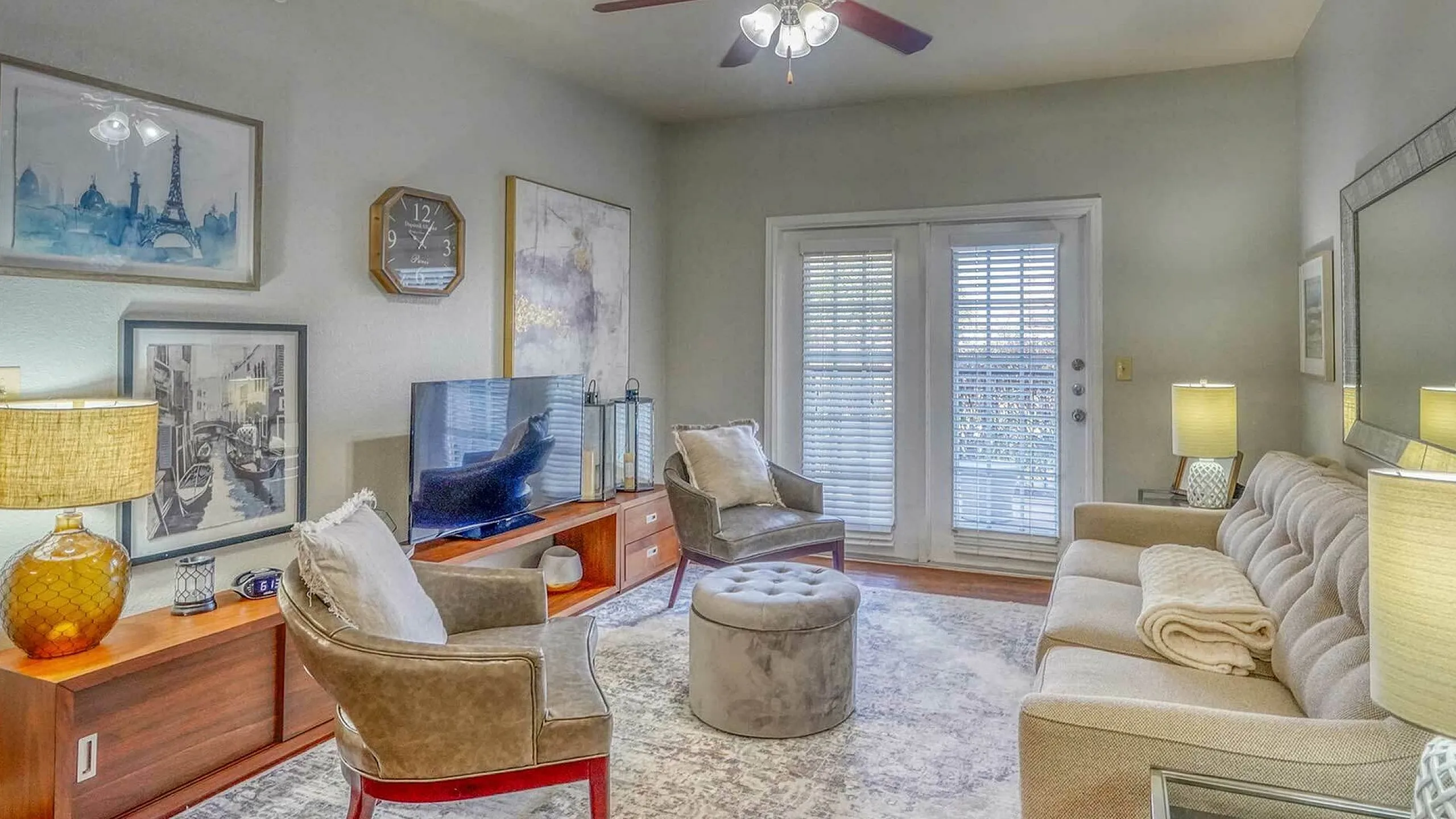 Inviting living room with modern decor, elegant sofa, cozy seating, and soft lighting, perfect for relaxation.