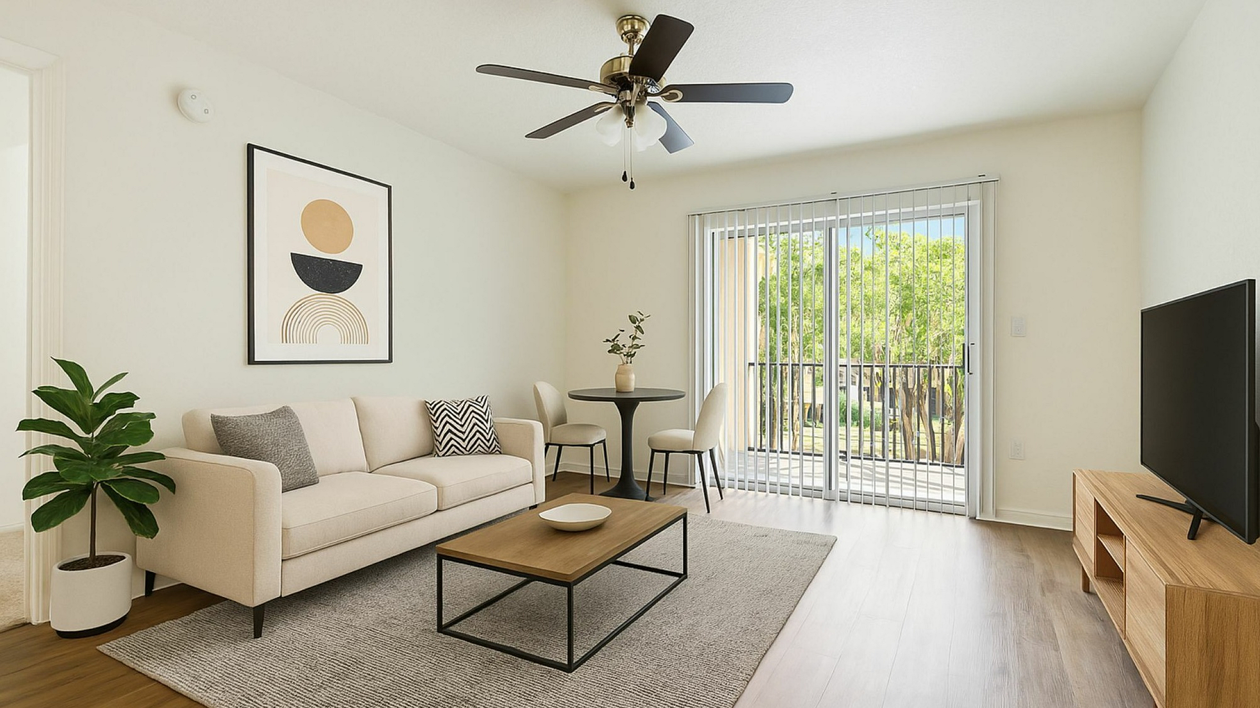 Bright, modern living room with cozy beige sofa, sleek coffee table, and stylish decor. Abundant natural light from large glass doors opens to a refreshing outdoor view.