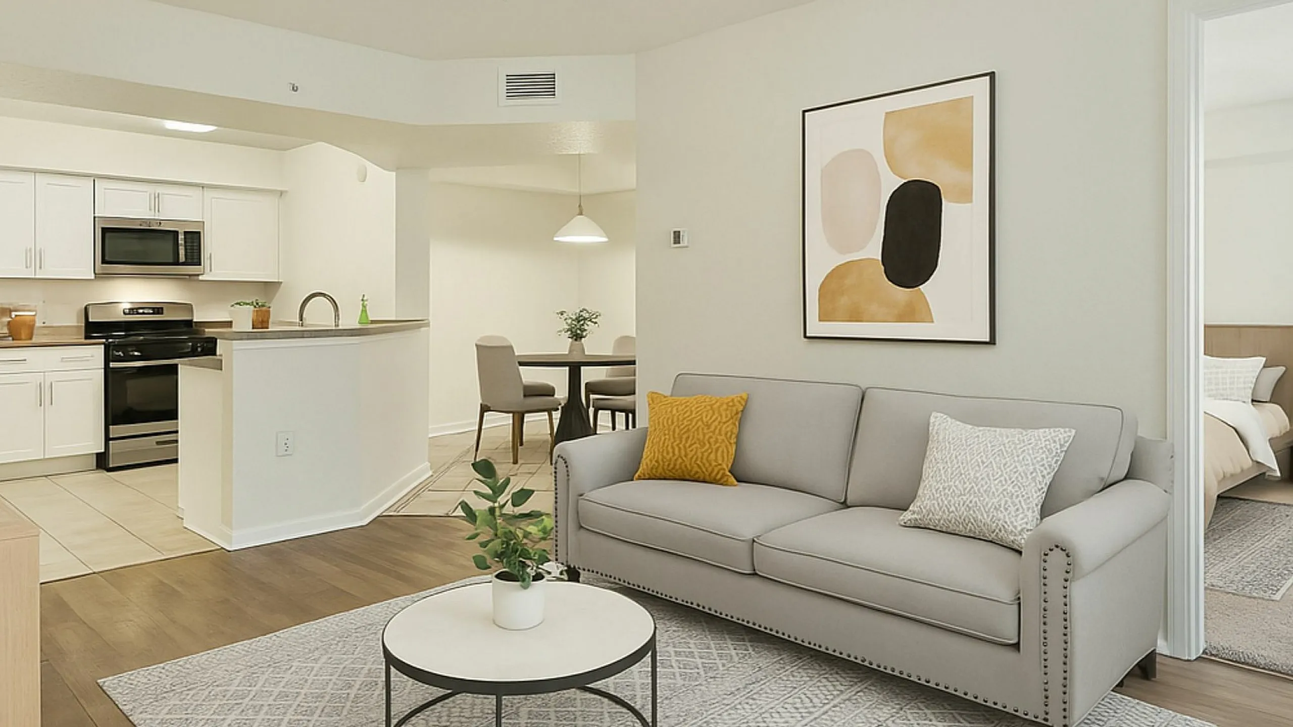 Modern open-concept apartment with sleek kitchen, cozy living room with stylish decor, and inviting dining area.