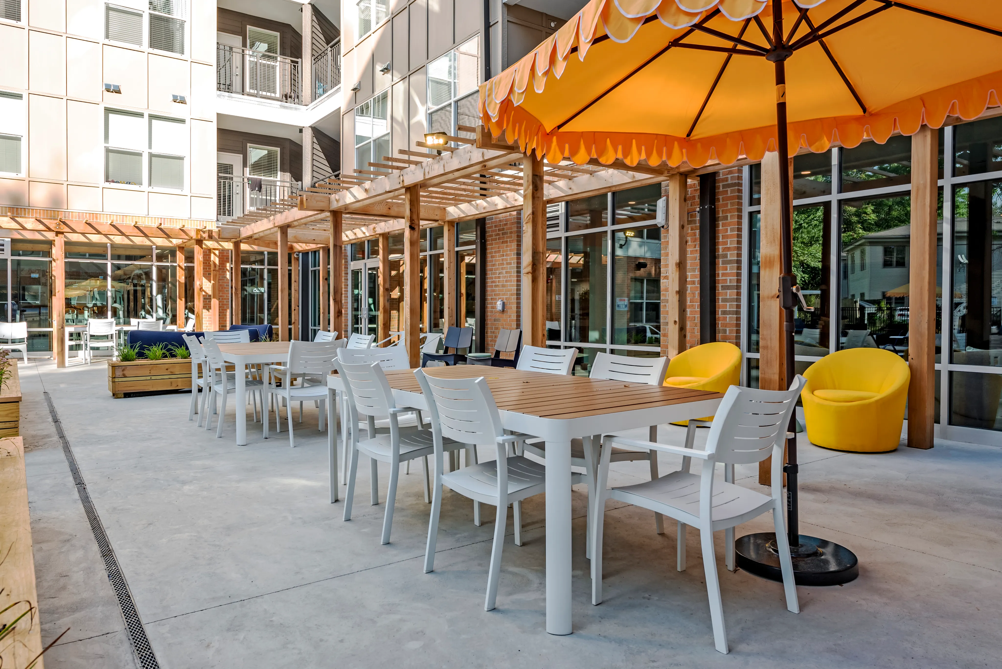 Exterior with canopy covered tales and seating at Paloma at Kent | Apartments near Kent State University