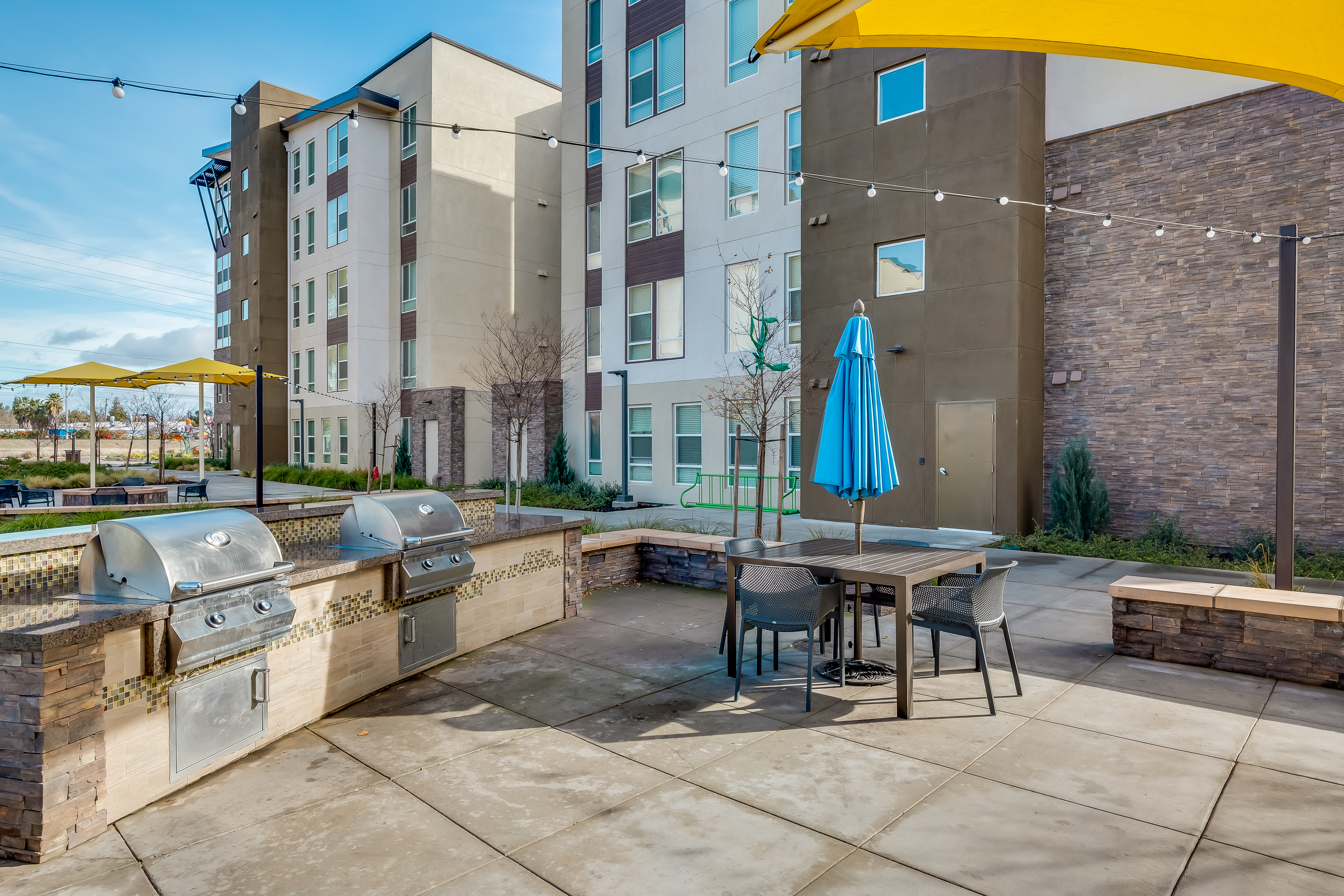 Image of Courtyard with Grill & Chill Space for The Crossings Student Apartments