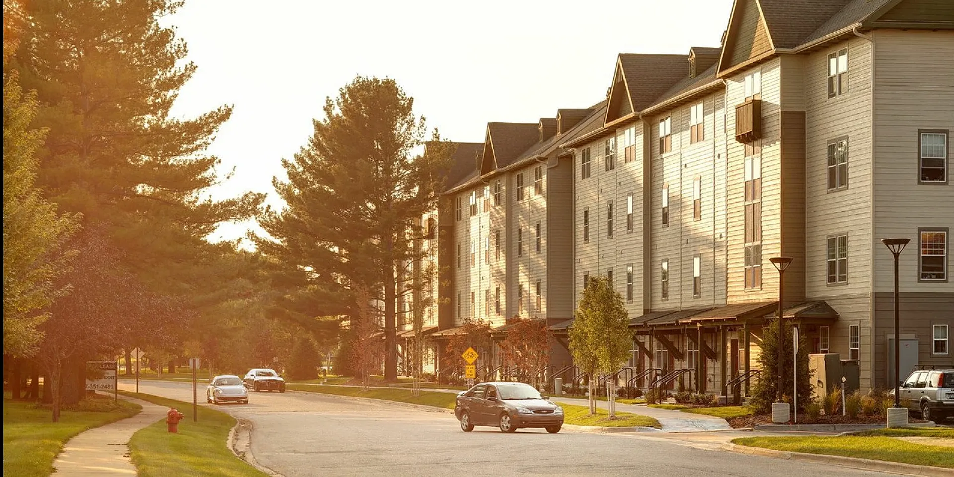 Experience the tranquility of this beautiful apartment community bathed in warm sunset hues.