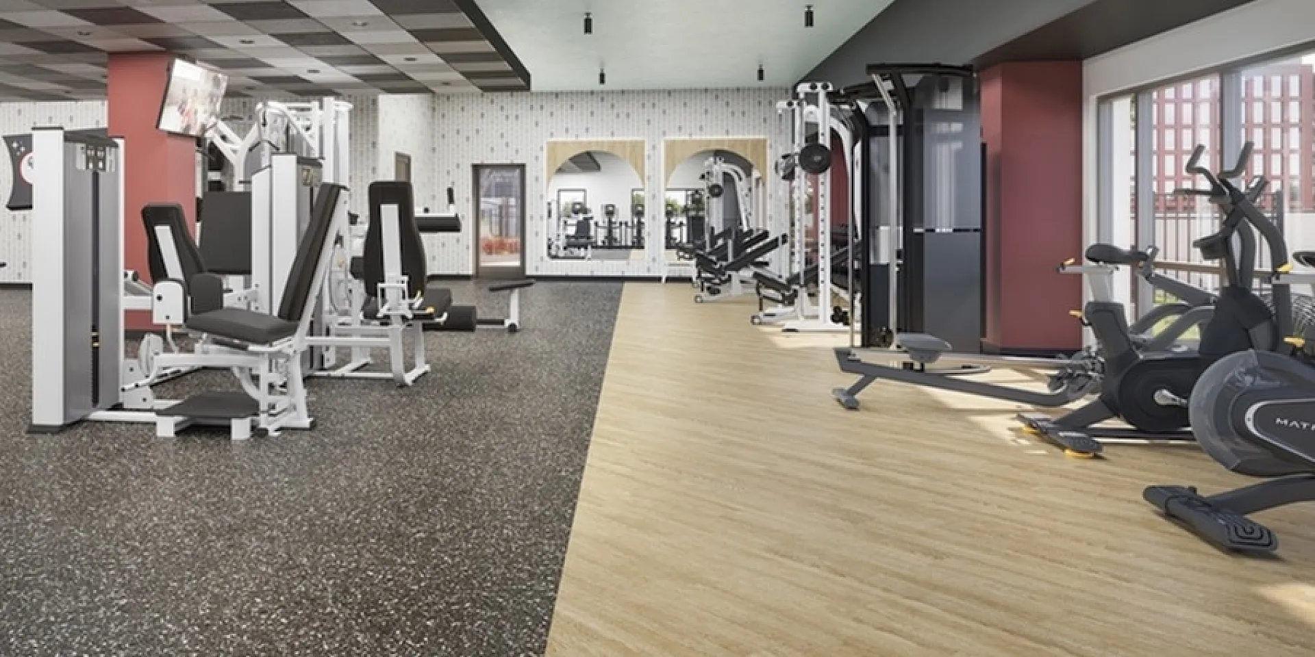Spacious and modern gym with state-of-the-art fitness equipment, sleek design, and ample natural lighting.