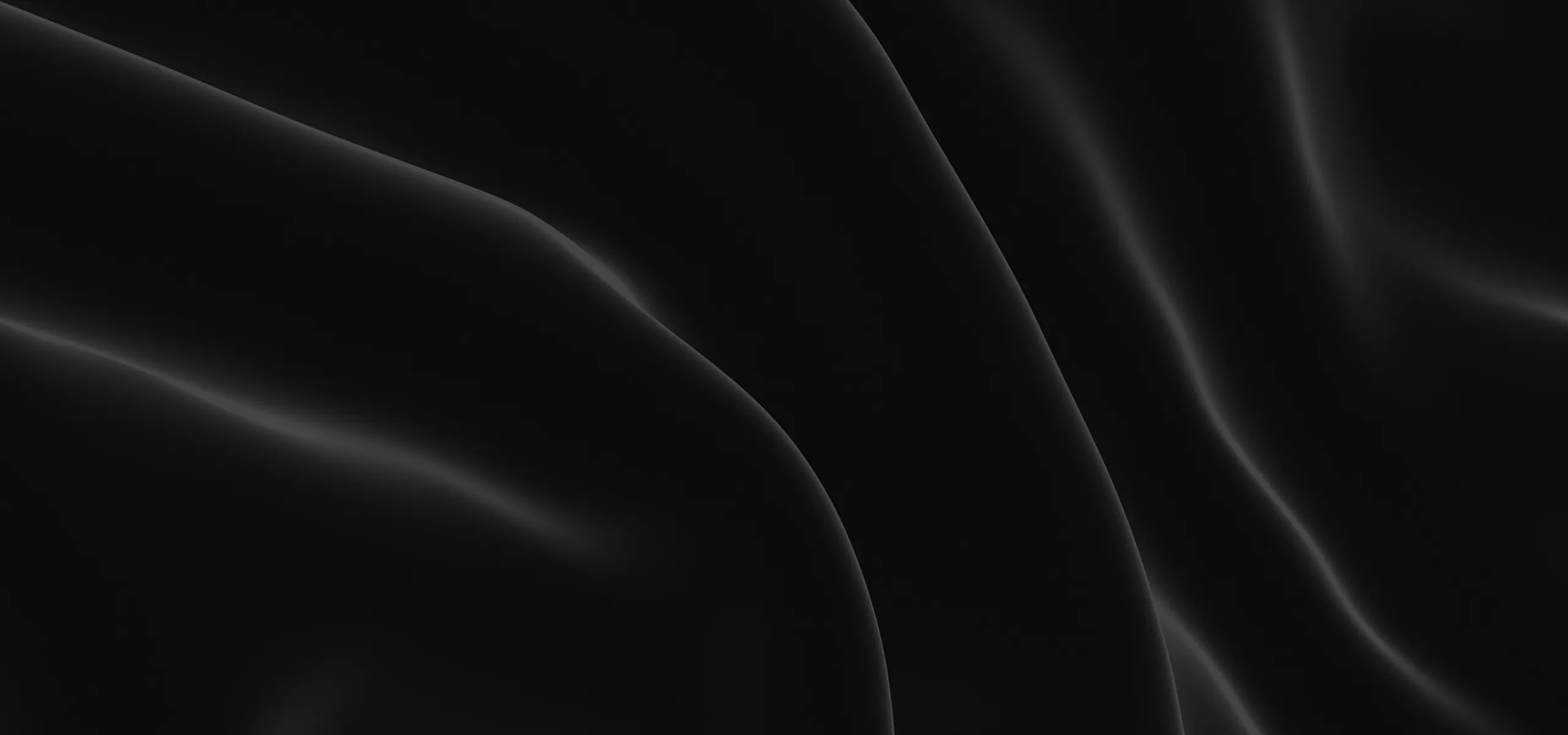 Luxurious close-up of black silk fabric showcasing elegant, smooth folds and a sophisticated texture.