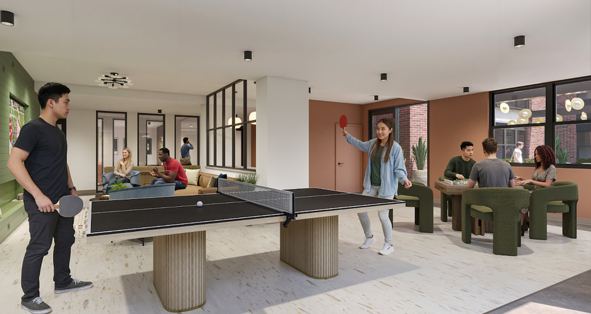 Vibrant communal space with a ping pong table and cozy seating, perfect for socializing and relaxation.