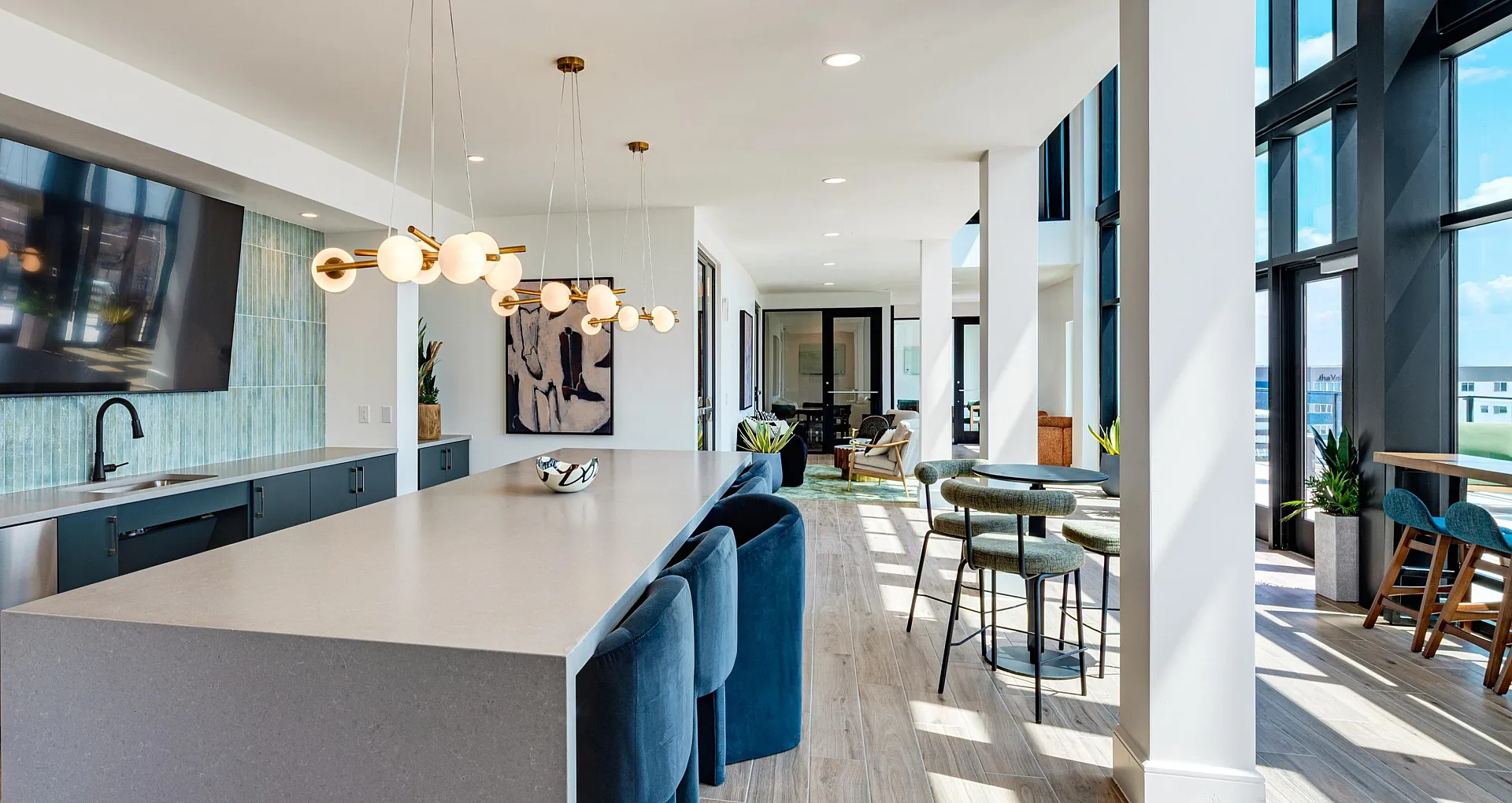 Luxurious modern apartment with stylish open-concept kitchen, sleek countertops, and expansive windows offering breathtaking views.
