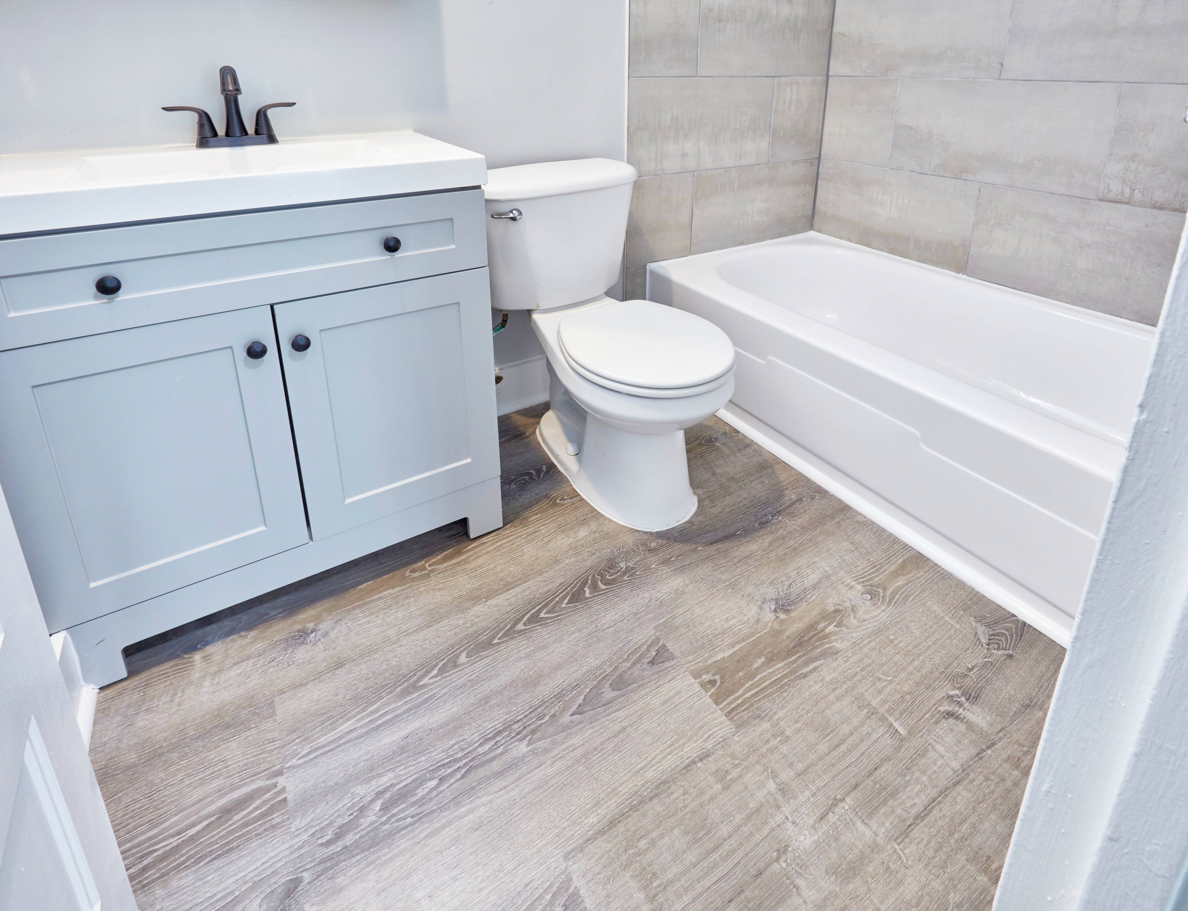 Stone top vanities, newly tiled bathrooms