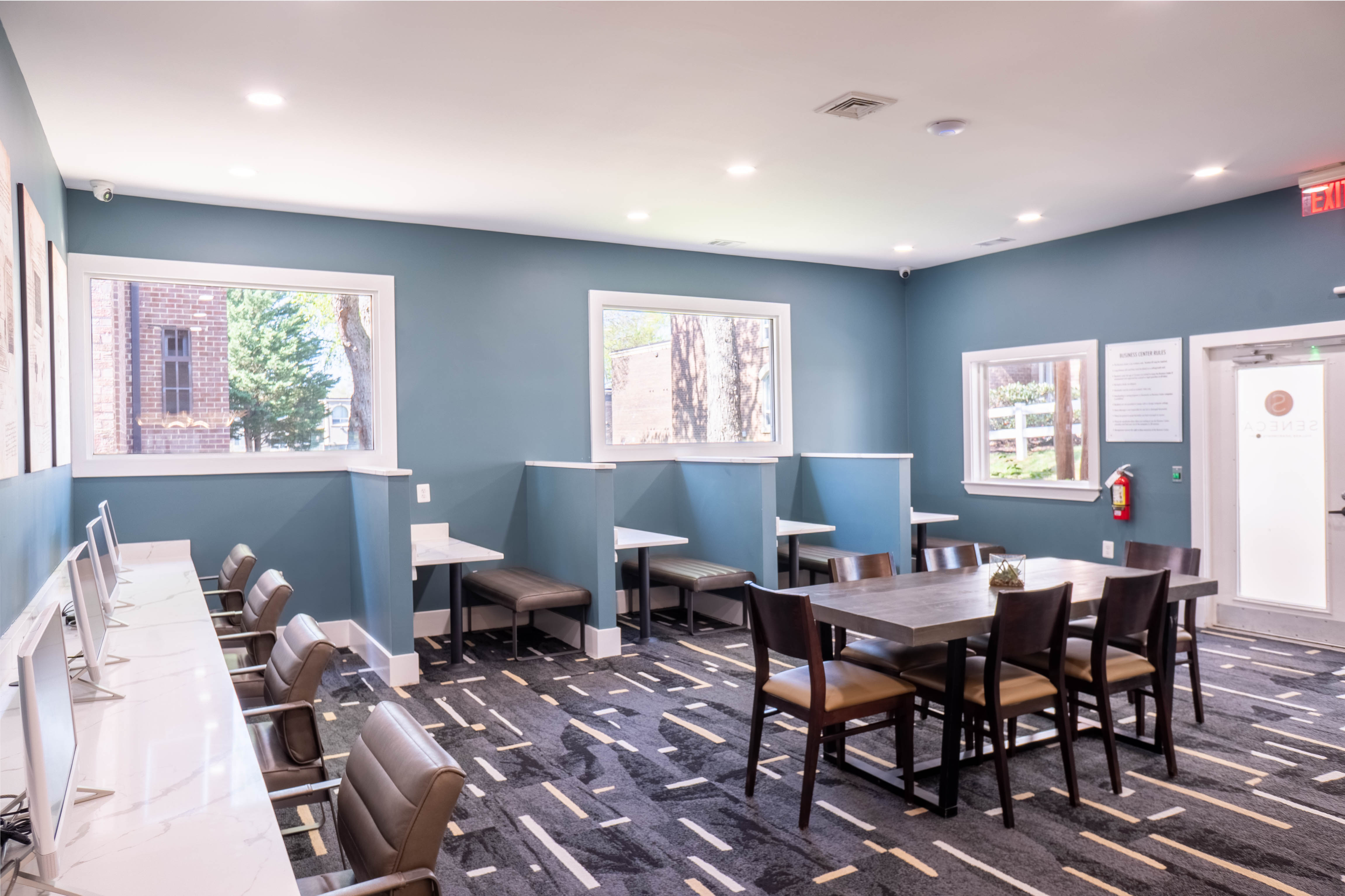 Bright and modern community office space featuring sleek workstations, comfortable chairs, and stylish decor.