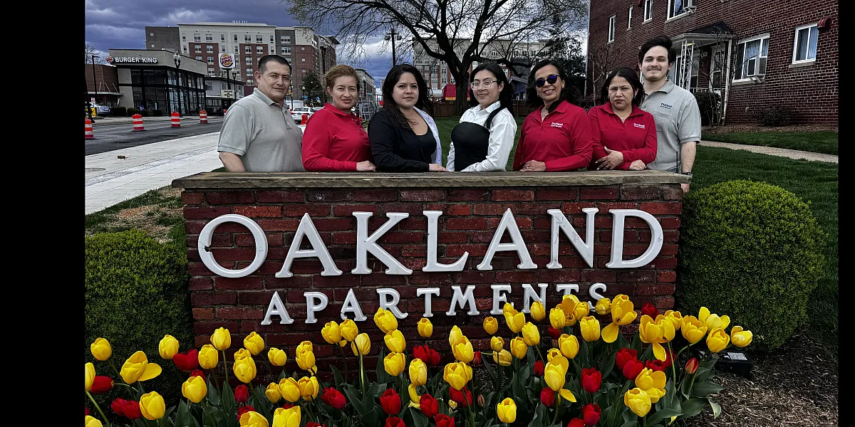 Warm and welcoming community at Oakland Apartments with vibrant tulips and friendly staff, nestled in a lively neighborhood.