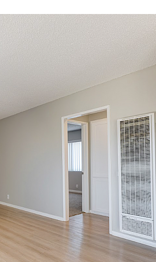 Bright and inviting living room with sleek hardwood floors and neutral walls, perfect for personalized decor.