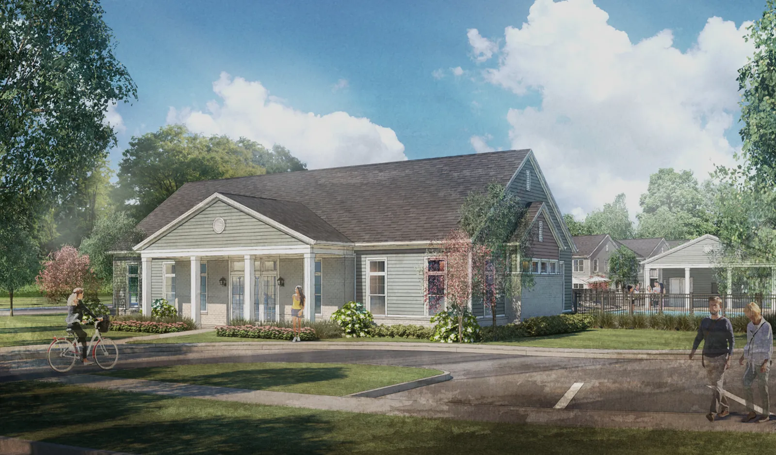 Charming residential complex with a picturesque front yard, inviting porch, and lush greenery, perfect for serene living and leisurely strolls.