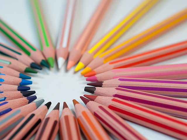 Vibrant array of colored pencils arranged in a captivating circular pattern.