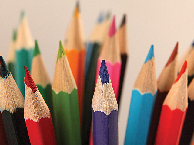 Vibrant collection of sharpened colored pencils in diverse hues, perfect for unleashing creativity and artistic expression.