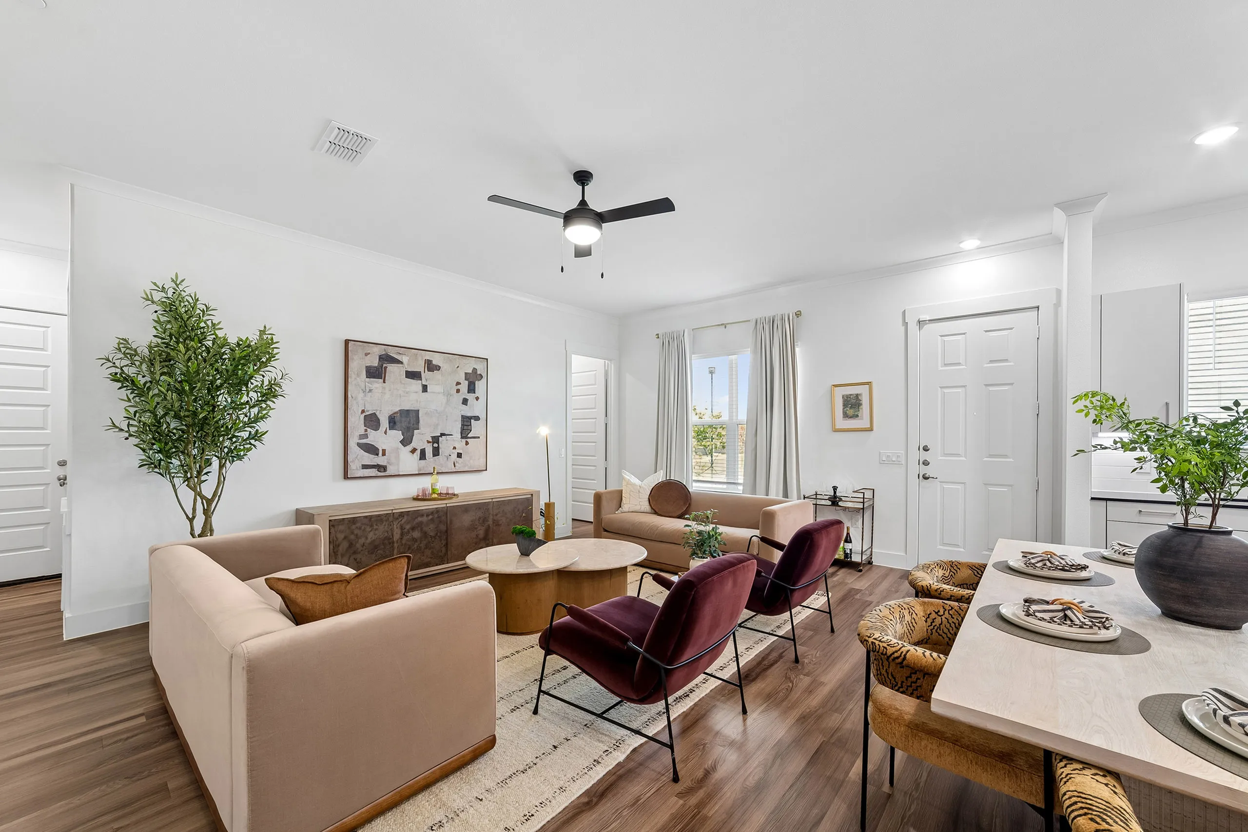 Inviting living room with modern furniture, elegant decor, and ample natural light creating a cozy ambiance.