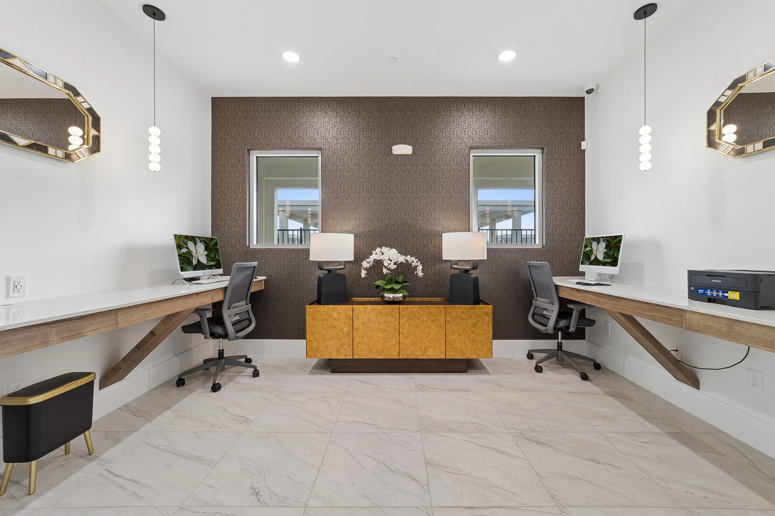 Chic home office with dual workstations, modern decor, and elegant lighting.