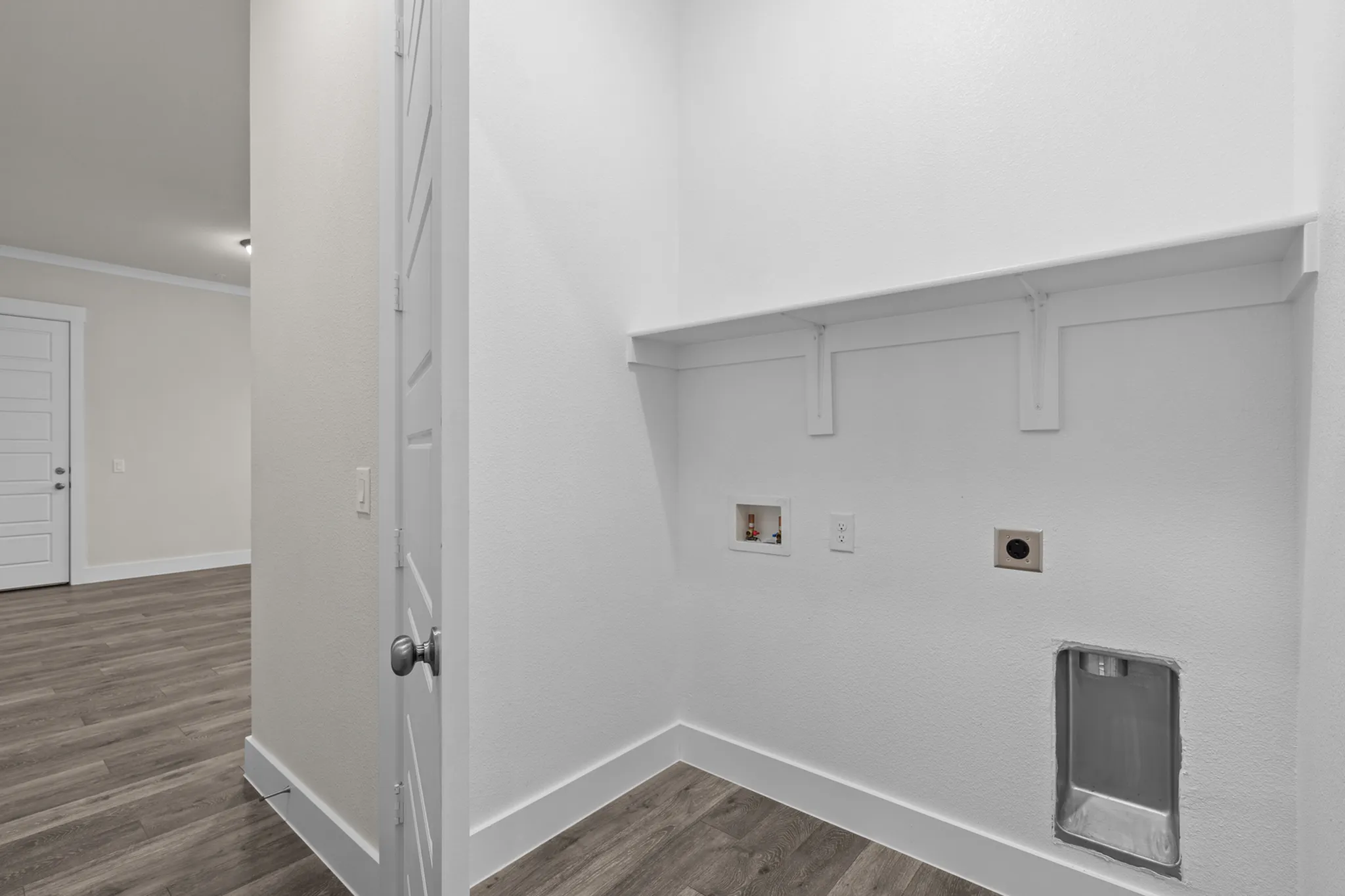 Spacious laundry nook with washer and dryer hookups | Apartments in Hutto, TX | Mansions Eight65