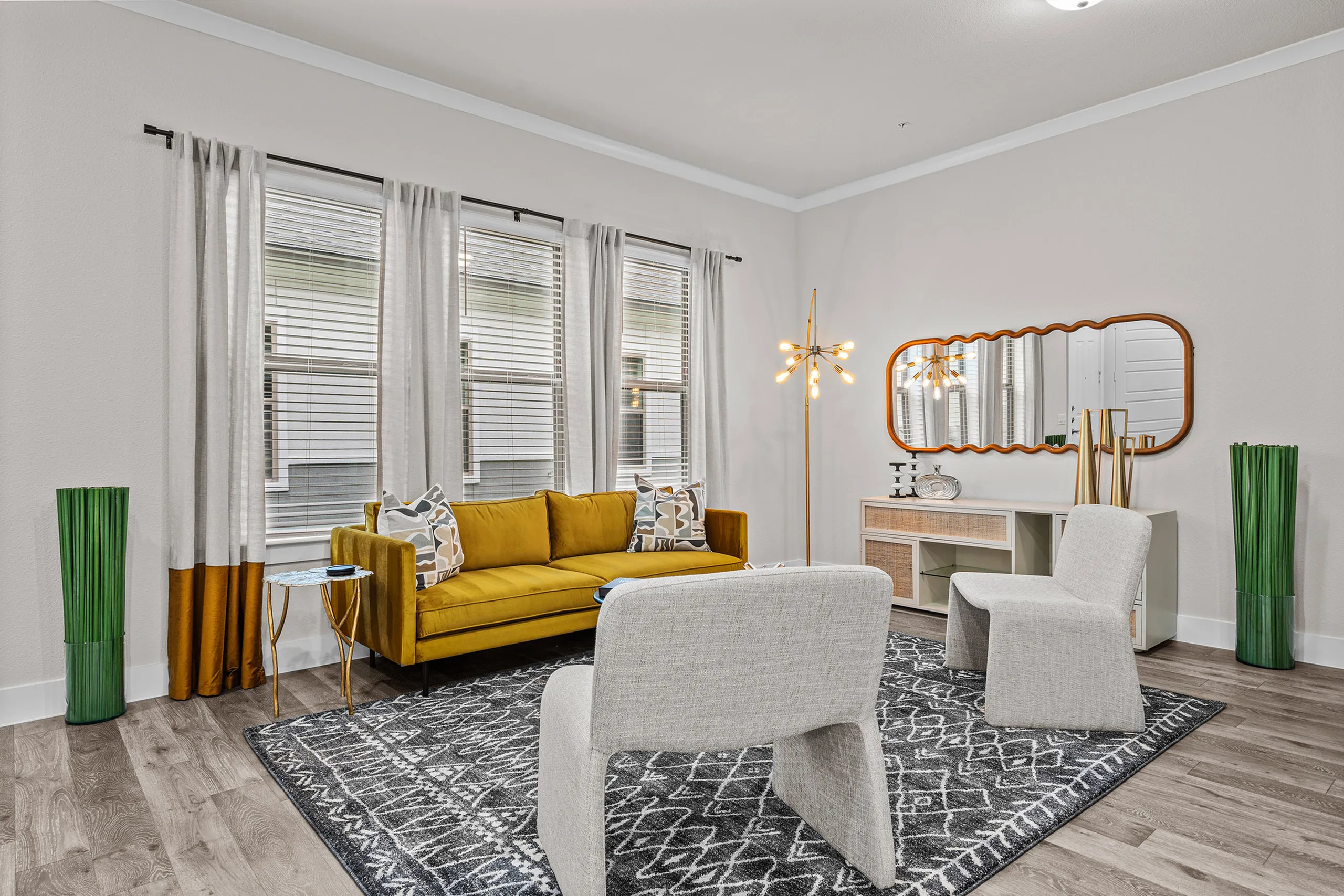 Modern living room with a stylish mustard yellow sofa, elegant lighting, and chic decor creating a welcoming atmosphere.