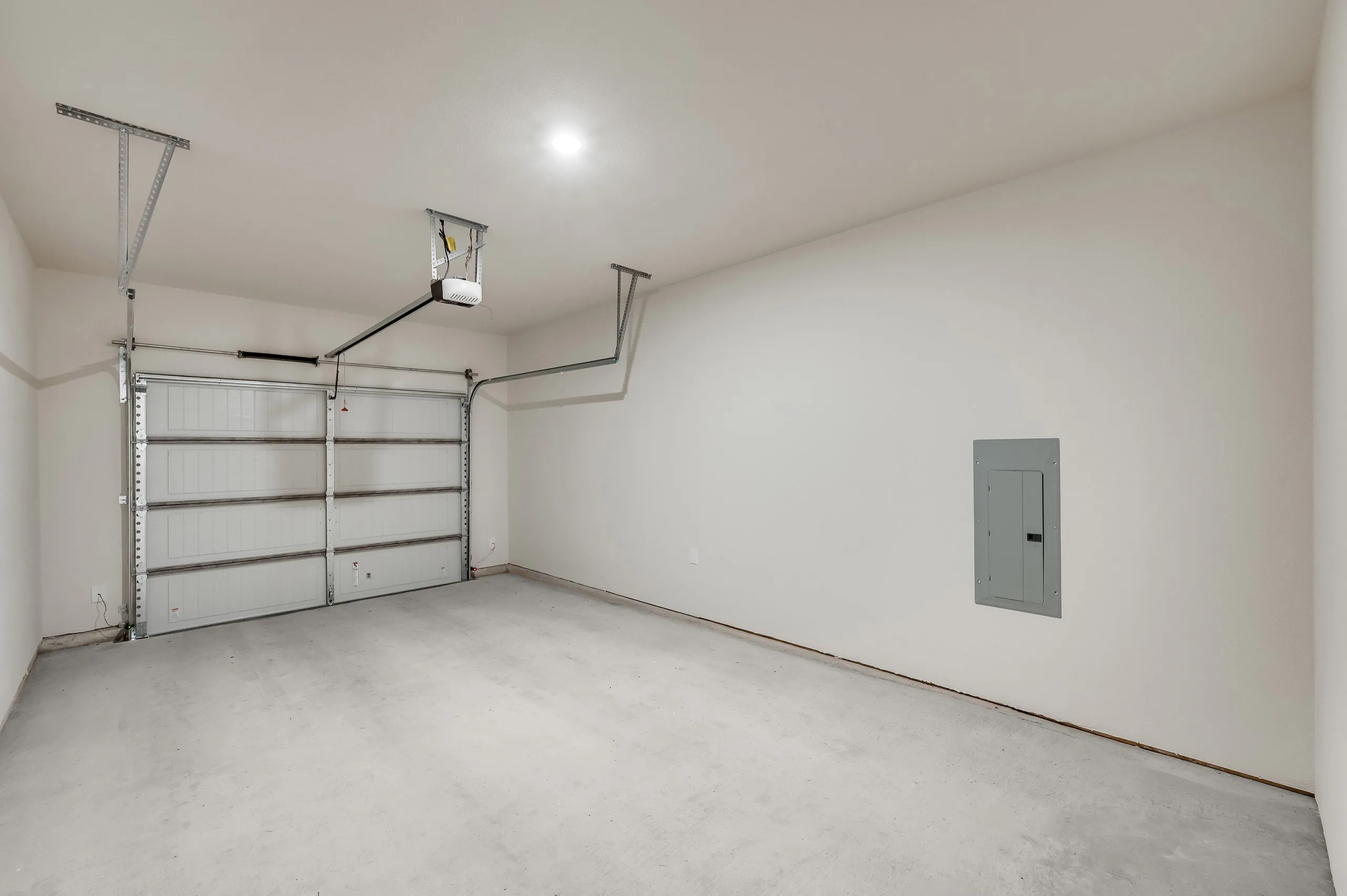 Spacious modern garage with sleek interior, perfect for secure parking and additional storage.