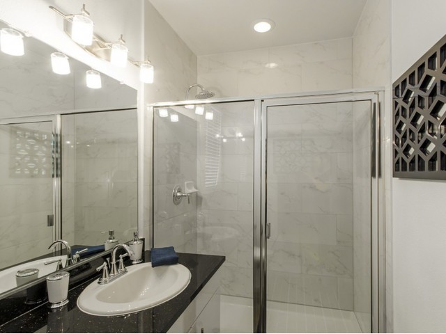Separate Stand-Up Showers with Rainwater Showerhead & Upgraded Plumbing Fixtures*