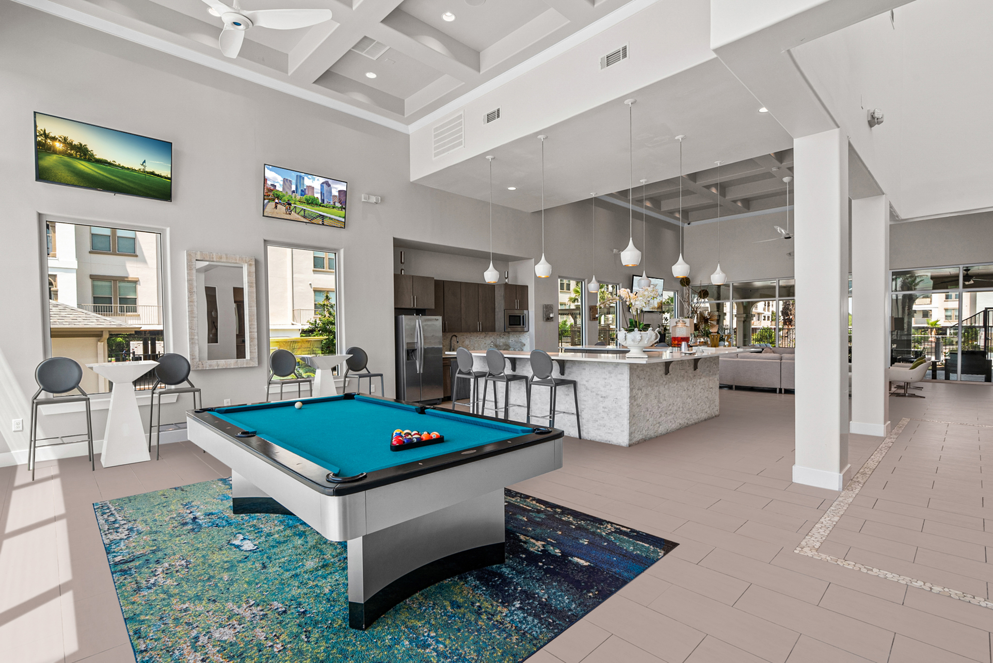 Stylish and modern recreation room featuring a sleek billiards table, chic bar area, and comfortable seating under elegant lighting. Perfect for relaxation and entertainment.
