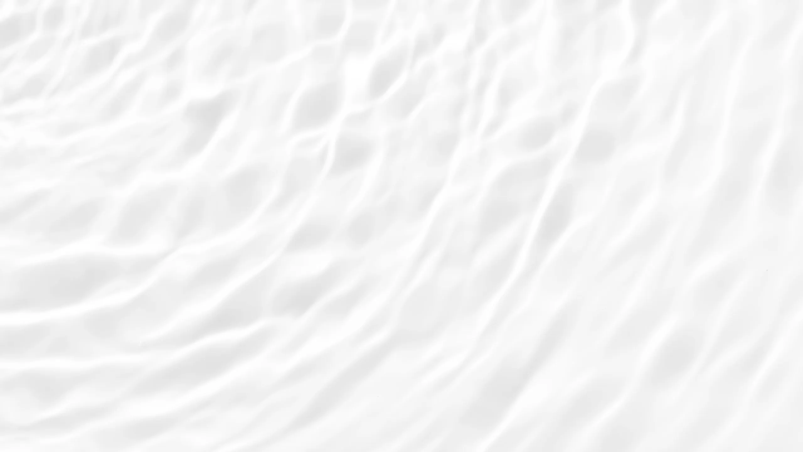 Abstract white texture resembling rippling water or soft fabric folds.