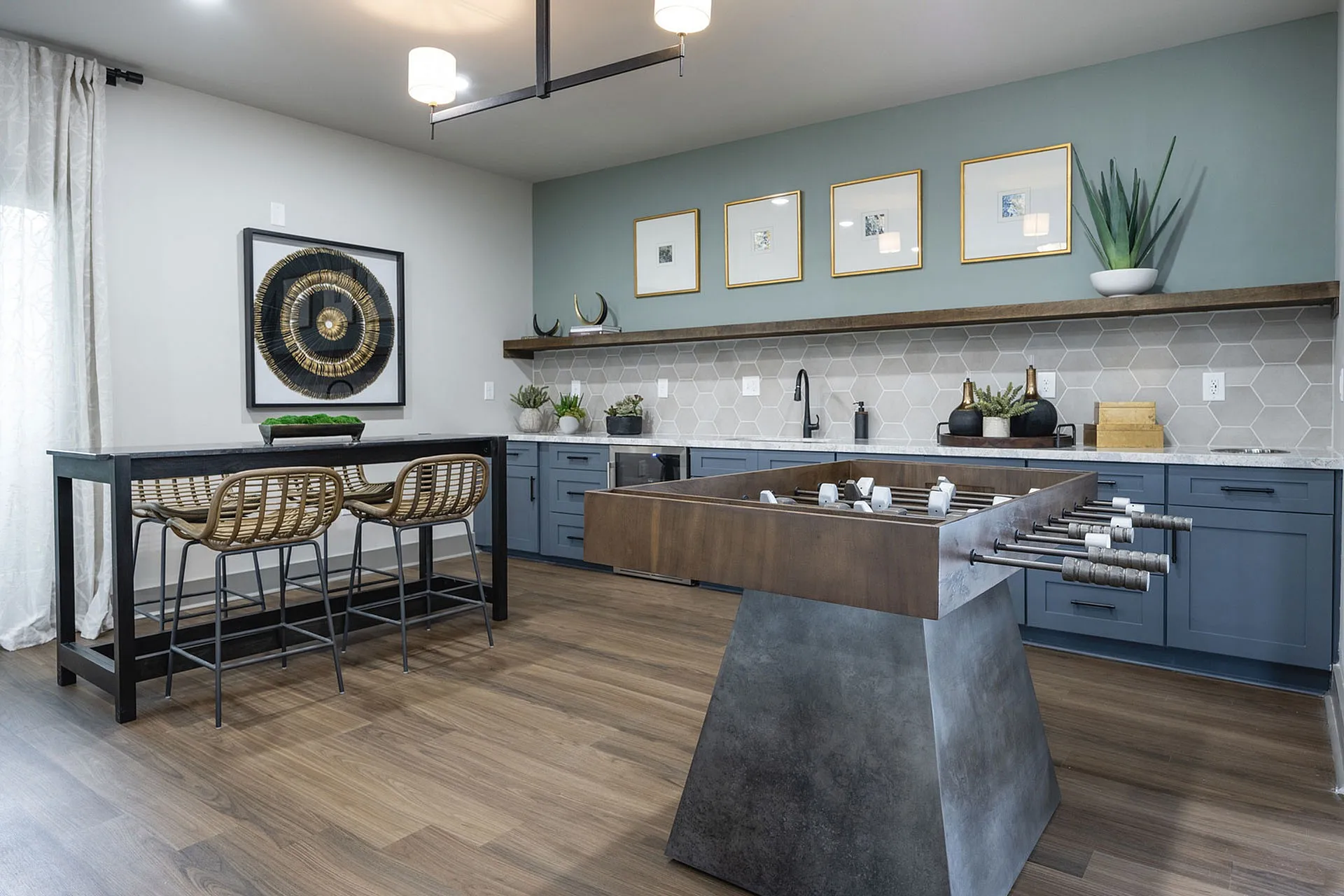 Elegant kitchen with stylish hexagonal backsplash, sleek cabinetry, and modern seating area, perfect for entertaining.