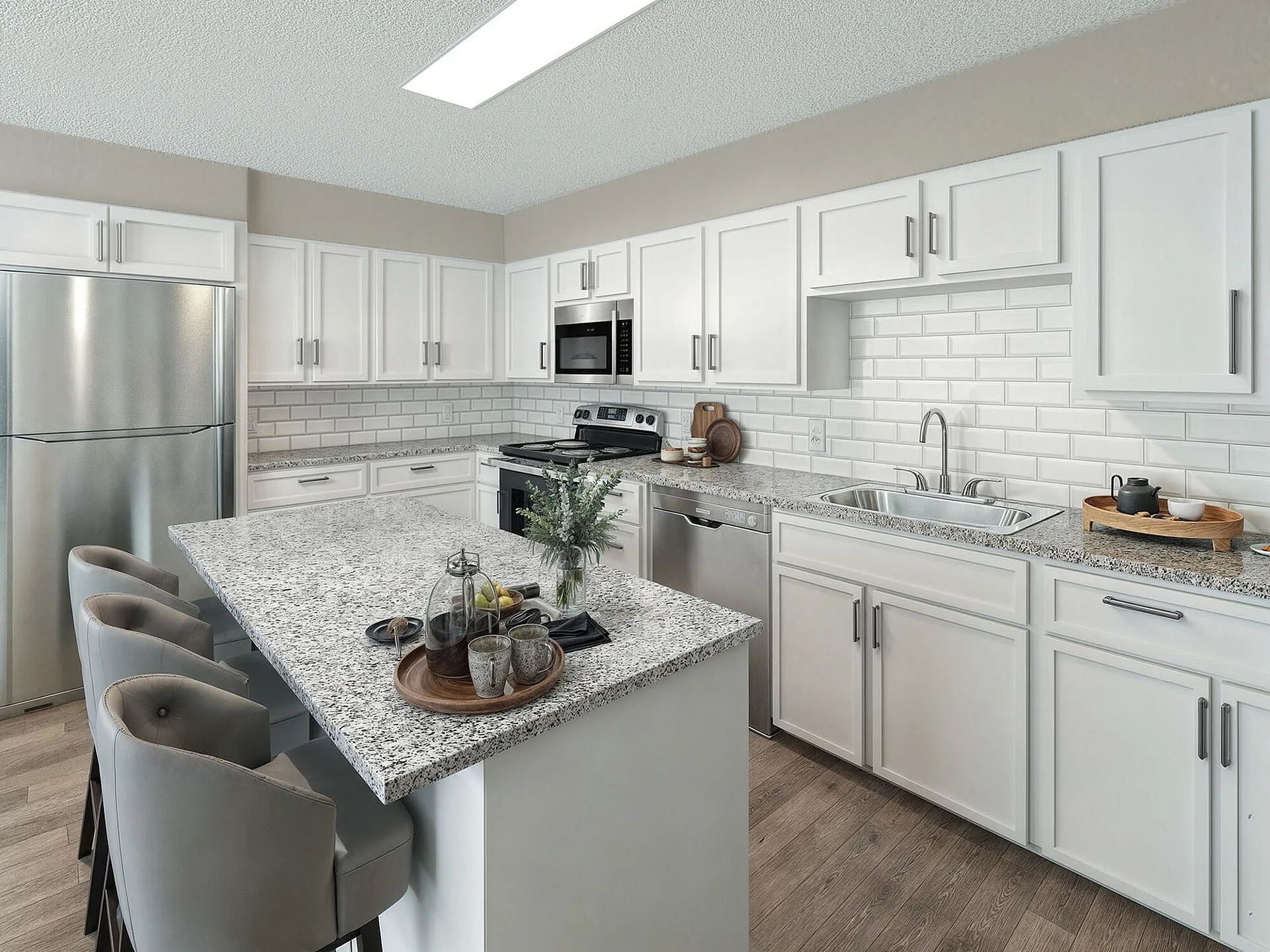 Modern kitchen with sleek granite countertops, stainless steel appliances, and elegant bar seating, perfect for entertaining.